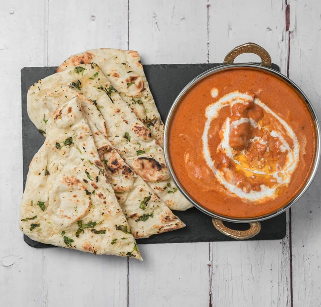 Butter Chicken with rich tomato gravy at Hot Mug Cafe in West Edmonton