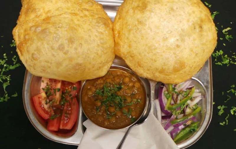 Chana bhatura with fluffy fried bread at Hot Mug Cafe in West Edmonton